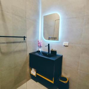 a bathroom with a sink and a mirror at Arabic Apartment in Safaga