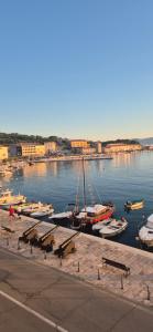 a group of boats are docked in a harbor at Senia Retro in Senj