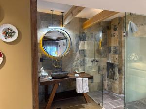 a bathroom with a sink and a mirror at Hotel Boutique Casa Laja in San Miguel de Allende