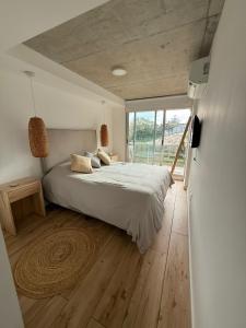 Ένα ή περισσότερα κρεβάτια σε δωμάτιο στο Apartamento en la Parada 18 de la Mansa - Edificio Mansa Inn I Residence