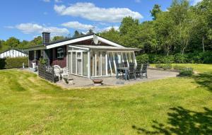 a gazebo with a table and chairs in a yard at 2 Bedroom Cozy Home In Farsø in Farsø +7 photos