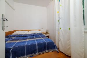 Postel nebo postele na pokoji v ubytování Apartment Regan