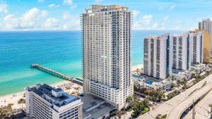 an aerial view of a city and the ocean at Luxurious 2BD Condo with Direct Ocean Front & Resort Pool in Sunny Isles in Sunny Isles