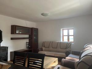 a living room with a couch and a table at Kota 1120 in Mojkovac