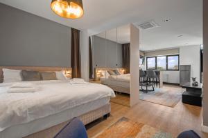 a bedroom with a bed and a large mirror at Uni88 Apart Hotel in Bucharest