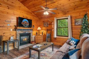 a living room with a couch and a fireplace at Black Bear Cove in Gatlinburg