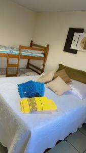 a bed with towels on top of it in a room at Chalanga in Nova Friburgo +66 photos