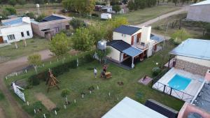 an aerial view of a house with a yard at Monoambientes Bajos Medanales in Victorica