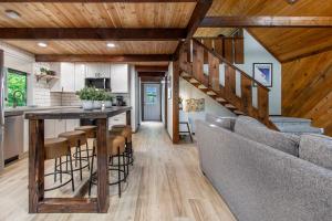 a kitchen and living room with a bar in a house at Powder to the People in Packwood