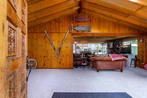 a living room with a large clock on the wall at Peak View | White Pass, Mt Rainier in Packwood