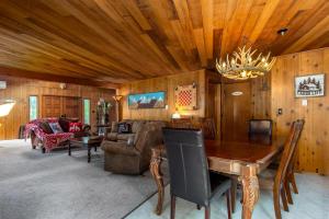 a living room with a couch and a table at Peak View | White Pass, Mt Rainier in Packwood