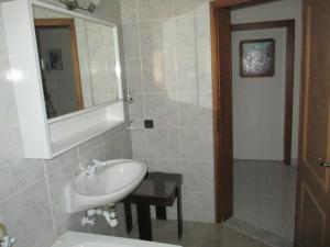 a bathroom with a sink and a mirror at Guest House Villa Daniel - Two Bedroom Apartment with Balcony in Omiš +12 photos