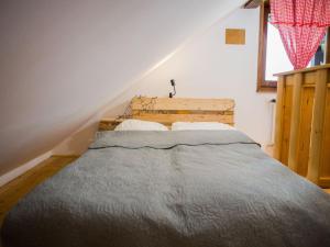 a bedroom with a bed in a room with a staircase at Holiday Home MILa - Duplex one bedroom Holiday Home with Terrace in Stubicke Toplice +12 photos