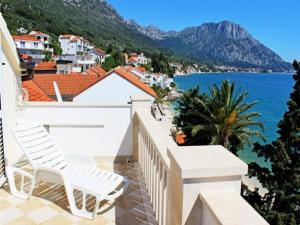 a balcony with a view of the ocean at Apartments Pansion Franka 3 - Apartment 11 in Brist +11 photos