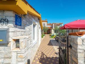 a building with a sign on the side of it at Holiday Home Luna - Holiday Home in Mednjan