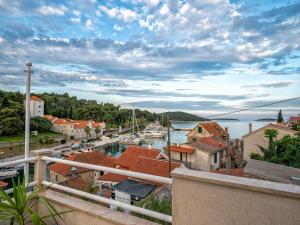 a view of a town with boats in a harbor at Holiday Home Lea - Three Bedroom Holiday Home with Terrace and Sea View in Maslinica