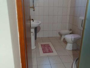 a bathroom with a toilet and a bidet and a sink at Apartmani Tea i Toni - Apartment Tea in Gradište +21 photos