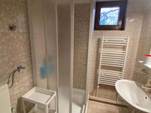 a bathroom with a shower and a sink at Three Bedroom Apartment with Terrace in Seget Vranjica +10 photos