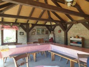 a room with a table and chairs in a building at One Bedroom Apartment with Balcony in Gajić