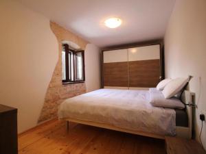 a bedroom with a large bed with a large mirror at Villa Adriana - Two Bedroom Villa in Bale