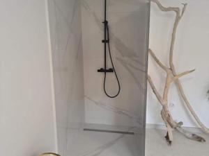 a shower with a hose in a white wall at Villa Adriana - Two Bedroom Villa in Bale +13 photos