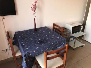 a table with a vase on top of it at Apartmani Villa Borzic - One Bedroom Apartment with Terarce and Sea View in Omiš