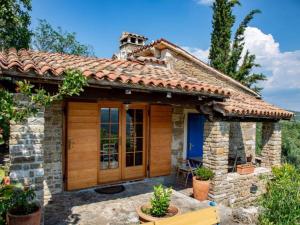 a small stone house with a roof at Villa Bella - Two Bedroom House in Grožnjan