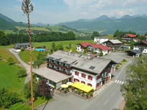 an aerial view of a small village with a house at Gasthof Mairwirt in Schwendt