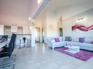 a living room with a couch and a table at Villa Ava - Five Bedroom Villa with Swimming pool in Šibenik