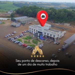a rendering of a parking lot with a red marker at Hotel Alvorada - Trindade do Sul in Trindade