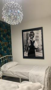 A bed or beds in a room at Casa Ammare