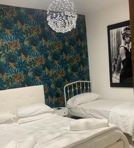 A bed or beds in a room at Casa Ammare