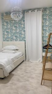 A bed or beds in a room at Casa Ammare