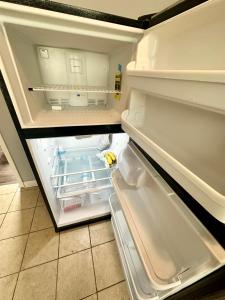 an empty refrigerator with its door open in a kitchen at Amazing Place to stay near Downtown Chicago! in Chicago