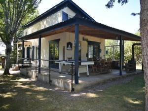 a house with a picnic table in front of it at Holiday Home in Saint-Honore near Gorges in Saint-Honoré-les-Bains