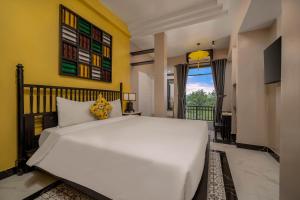 Ένα ή περισσότερα κρεβάτια σε δωμάτιο στο Old Town Hotel +37 φωτογραφίες