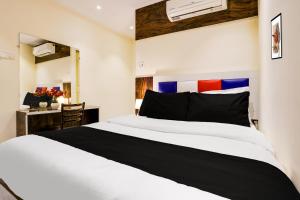 Postel nebo postele na pokoji v ubytování Hotel Orange Residency