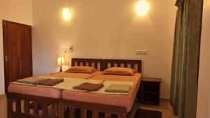 Postel nebo postele na pokoji v ubytování Mailagama Cinnamon Residence