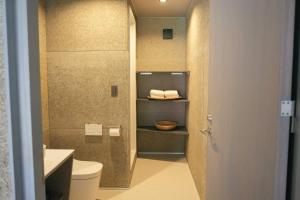 a bathroom with a toilet and a sink at cafe&hostel TMC in Tsuwano +33 photos