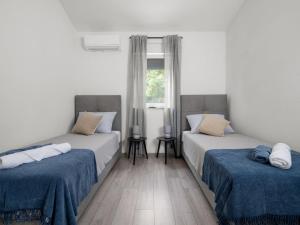 Ένα ή περισσότερα κρεβάτια σε δωμάτιο στο Three Bedroom Villa with Swimming Pool +12 φωτογραφίες