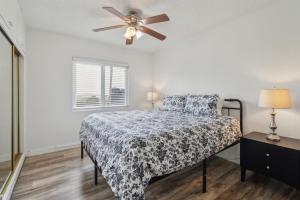 a bedroom with a bed and a ceiling fan at Beautiful 2 Bed Beach Condo #203 in Carpinteria