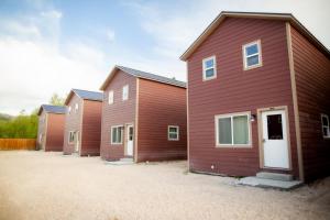 a row of houses parked next to each other at The IronHorse Inn in Garden City