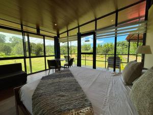 Postel nebo postele na pokoji v ubytování Quinta DCristhi Lodge + 10 fotografií