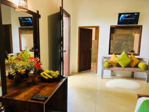 A television and/or entertainment centre at Garcinia Leaf