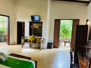 A television and/or entertainment centre at Garcinia Leaf