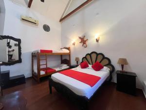Postel nebo postele na pokoji v ubytování La Casa del Viajero Mompos + 26 fotografií