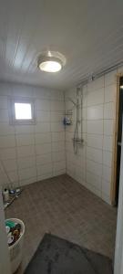 an empty room with a shower and a ceiling at Omakotitalo Pirintie 22, Härmä in Kauhava +23 photos