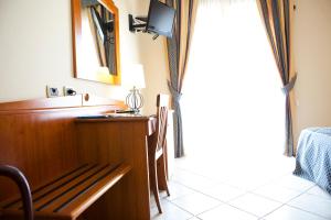 TV a/nebo společenská místnost v ubytování Hotel Barbieri