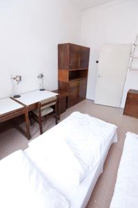 A bed or beds in a room at Hostel Hlávkova