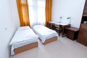 Postel nebo postele na pokoji v ubytování Hostel Hlávkova